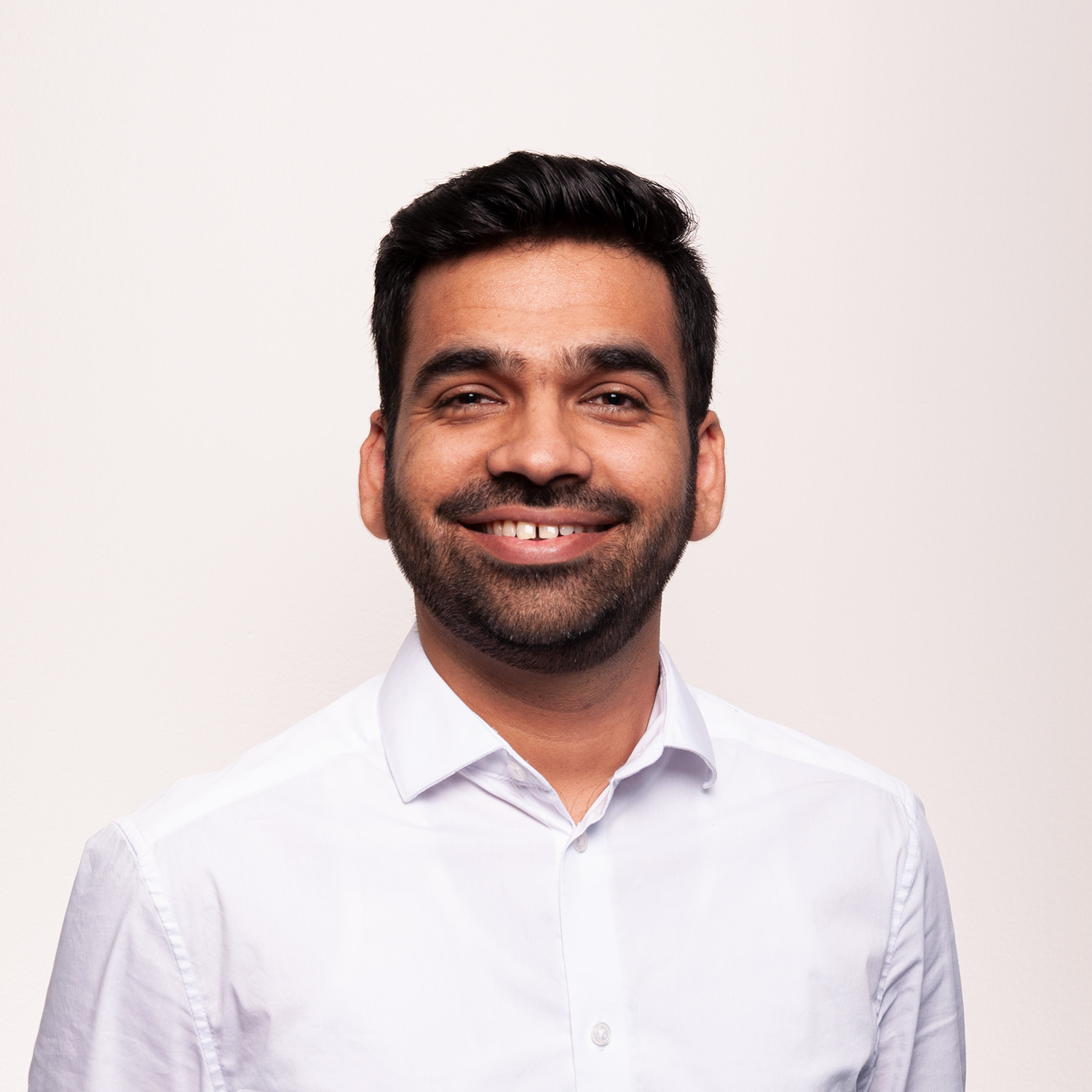 Photo of a man wearing a white shirt